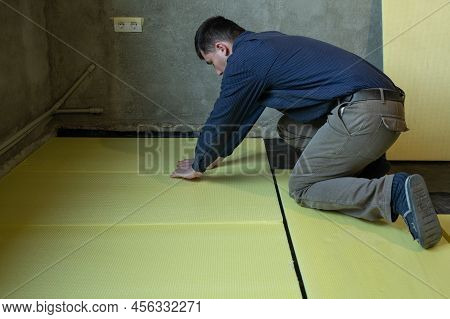 Installation Of Expanded Polystyrene For Floor Insulation.