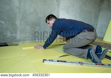 Installation Of Expanded Polystyrene In The Room For Floor Insulation, Repair Work Alone, Yellow Exp