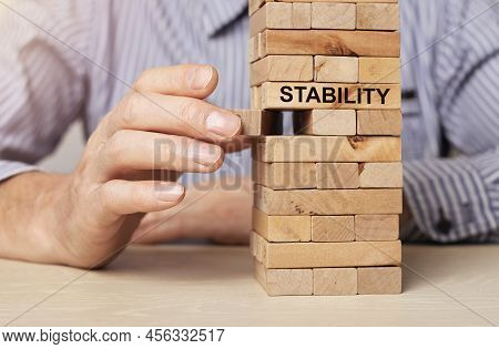 Concept Of Ruining Balance And Stability In Business And Economy. Unstable And Instability. High Qua