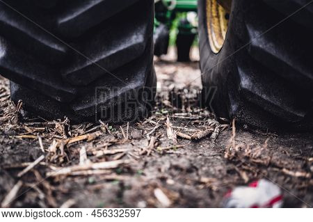 Soil Compaction Caused By A Dual Tractor Tires Over Topsoil Dirt In An Empty Field Before Planting.