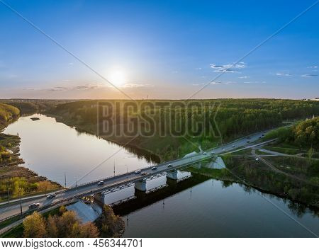 Beautiful View Of The Bridge Across The Iset River In The City Of Kamensk-uralsky At Sunset In Sprin