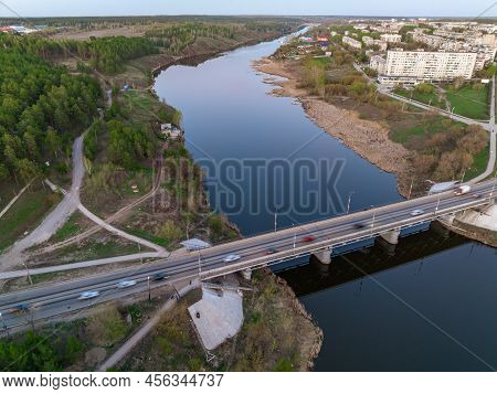 Beautiful View Of The Bridge Across The Iset River In The City Of Kamensk-uralsky At Sunset In Sprin