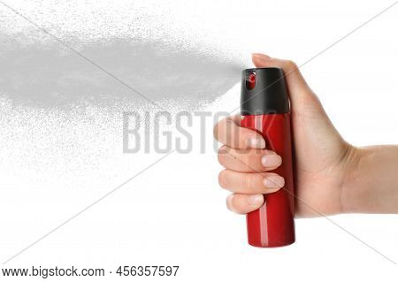 Woman Using Pepper Spray On White Background, Closeup