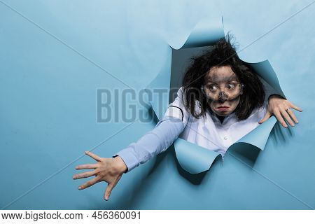 Young Adult Chemist With Wacky Look, Messy Hair And Dirty Face Acting Goofy After Experiment Explosi