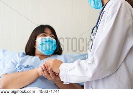Women Asian Doctors Hold The Patient Hand And Encourage And Provide Medical Advice While Checking Th