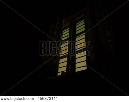 Stock Photo Of Rectangle Shape Window With Grill In Living Room With Floral Curtains. Picture Captur