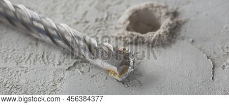 Drill Bit Make Holes In Concrete Wall With Industrial Drill. Building Work Industry.