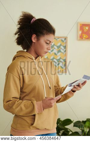 Diappointed Teenge Girl Opening Letter From University