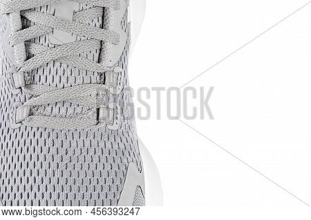 New Unbranded Running Sneaker Or Trainer On White Background. Men's Light Grai Sport Footwear. Close