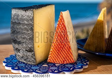 Assortment Of Spanish Hard Cheeses, Curado, Manchego, Goat Cheese Served Outdoor With Membrillo Jam