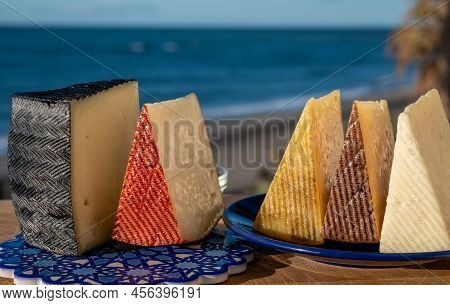 Assortment Of Spanish Hard Cheeses, Curado, Manchego, Goat Cheese Served Outdoor With Membrillo Jam