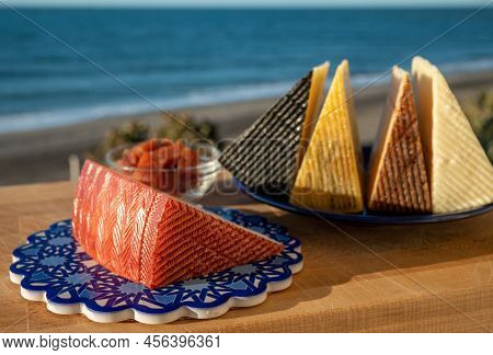 Assortment Of Spanish Hard Cheeses, Curado, Manchego, Goat Cheese Served Outdoor With Membrillo Jam