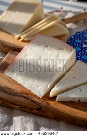 Spanish Hard Manchego, Cow, Sheep And Goat Cheese Served Outdoor In Morning Sunlights