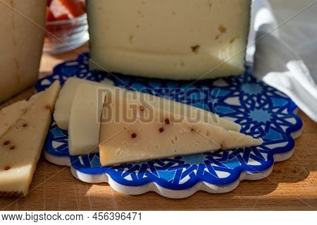Spanish Hard Manchego, Cow, Sheep And Goat Cheeses Served Outdoor With Membrillo Jam In Sunlights