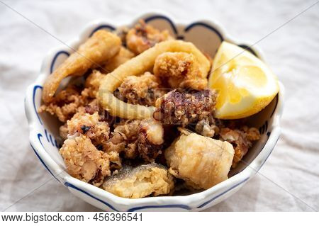 Spanish Sea Food, Cripsy Deep Fried Baby Octopus, Fish, Calamari Rings Served With Lemon