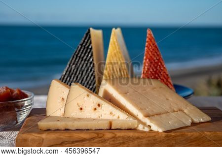 Assortment Of Spanish Hard Cheeses, Curado, Manchego, Goat Cheese Served Outdoor With Membrillo Jam