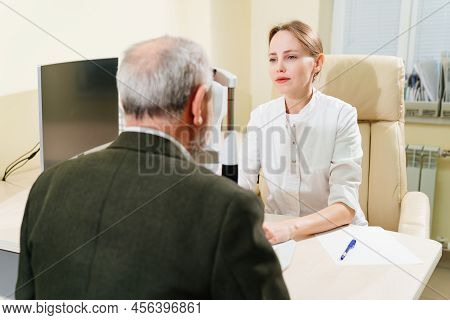 Ophthalmologist Examination Of Elderly Man On Corneo Topographer.modern Clinic