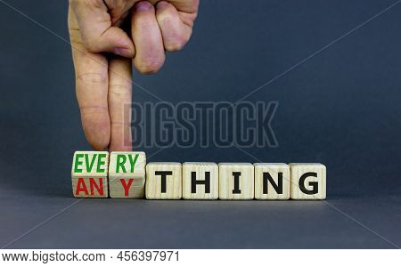 Anything Or Everything Symbol. Businessman Turns Cubes And Changes The Concept Word Anything To Ever
