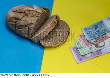 Homemade Baked Wheat Loaf Of Bread On National Ukrainian Flag Background, Yellow-blue Color With Hri