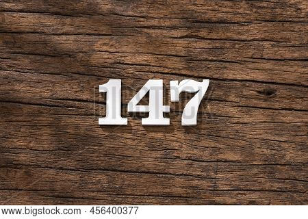 Number 147 - Piece On Rustic Wood Background