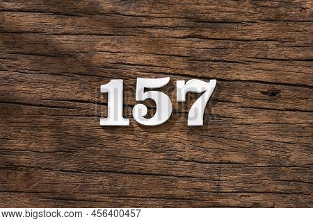 Number 157 - Piece On Rustic Wood Background