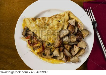 Mushroon Peppers And Onion Omelet With Homefries