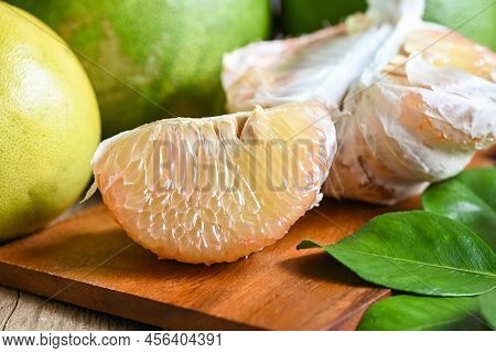 Pomelo Fruit On Wooden Background, Fresh Green Pomelo Peeled And Leaf Frome Pomelo Tree , Pummelo , 