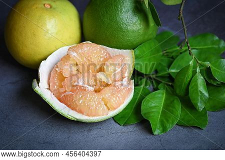 Pomelo Fruit And Dark Background, Fresh Green Pomelo Peeled On Plate And Green Leaf Frome Pomelo Tre