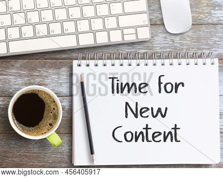Time For New Content Text In Notebook,top View Wit Pencil,keybroad And Coffee On Wood Table Backgrou