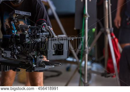 Movie Shooting Or Video Production And Film Crew Team With Camera Equipment. Video Camera Operator W