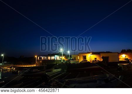 Night View Of The Linosa Old Pier, Pelagie Islands. Sicily