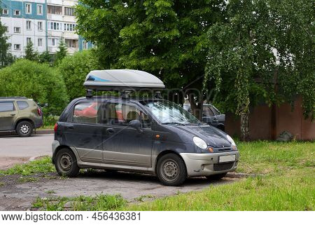 A Microliter With An Upper Closed Trunk Is Parked In The Courtyard Of A Residential Building, Iskrov