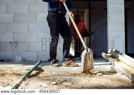 Cropped Worker Builders, Men In Uniform And Caps, Labors, Wetbacks Preparing Foundation Floor For Bu
