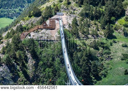 Canillo, Andorra. 2022 June 9. People Walking On The Longest Tibetan Bridge In Europe, 600 Meters Lo