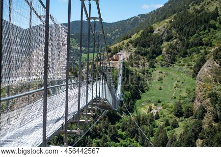 Canillo, Andorra. 2022 June 9. People Walking On The Longest Tibetan Bridge In Europe, 600 Meters Lo