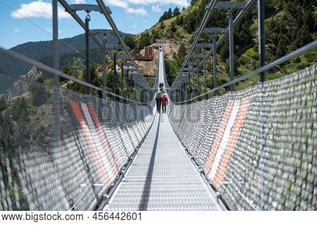 Canillo, Andorra. 2022 June 9. People Walking On The Longest Tibetan Bridge In Europe, 600 Meters Lo
