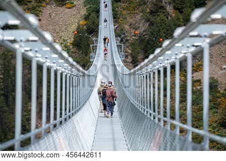 Canillo, Andorra. 2022 June 9. People Walking On The Longest Tibetan Bridge In Europe, 600 Meters Lo