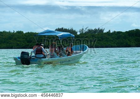 Felipe Carrillo Puerto, Quintana Roo, Mexico - February 05.2022 Tourists In Life Jackets Ride Down T