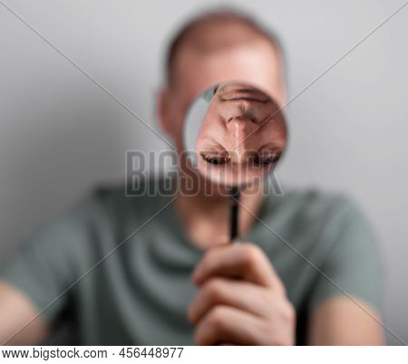 Man Suffering From Bipolar Disorder, Distorted Self Perception. High Quality Photo