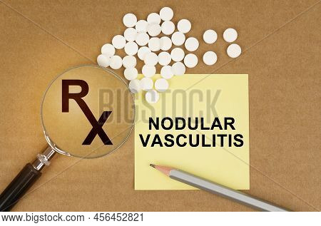 Medical Concept. On The Table Are Pills, A Magnifying Glass, Pencils And A Sticker With The Inscript