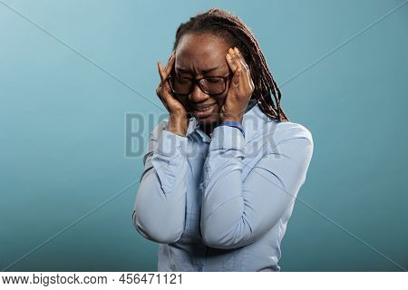 Unwell And Ill Woman Suffering From Painful Head Migraine Putting Pression To Temples With Fingers. 