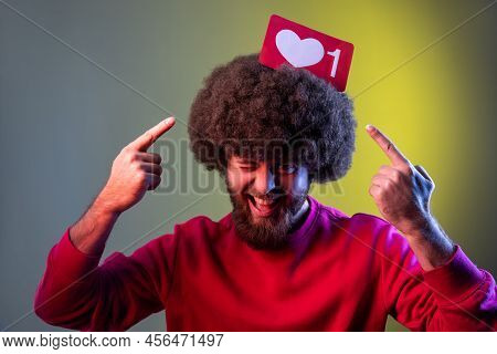 Hipster Man Holding Pointing At Heart Like Icon Of Social Media On His Head, Notification Button To 