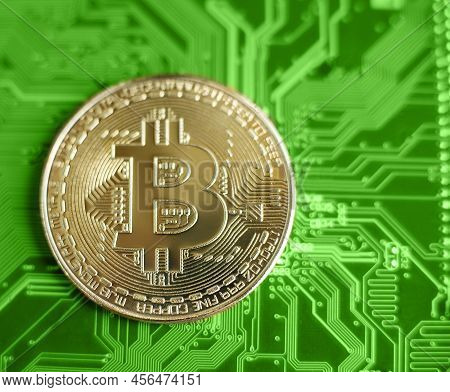Bitcoin And Motherboard. Crypto Currency Gold Bitcoin, Btc, Bit Coin. Macro Shot Of Bitcoin Blockcha