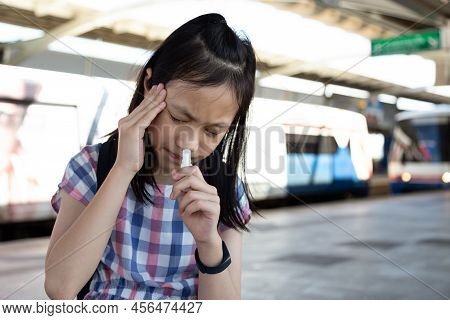 Asian Girl With Vertigo,dizziness,migraine,sick Depressed Girl Suffering From Headache,outdoor In Ci