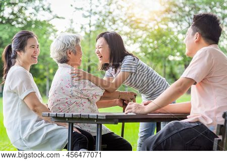Happy Asian Family,father,mother With Funny Child Girl Play,laugh And Hugging Grandmother Having Fun