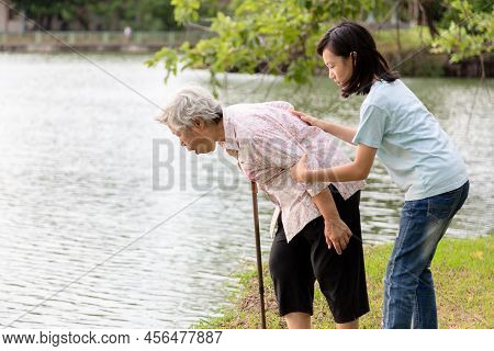 Asian Senior Grandmother About To Throw Up,vomit,puke Retch Barf,feeling Sick From Indigestion Or Fo