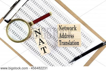 Nat Network Address Translation Text On Wooden Block On A Chart Background