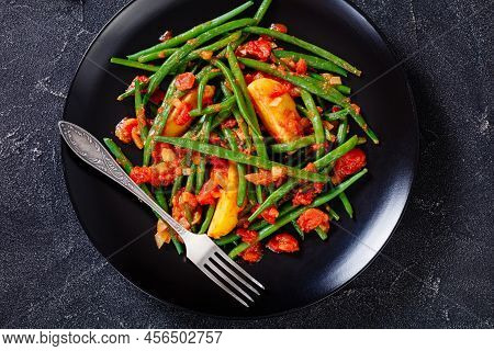 Fasolakia Lathera, Green Beans, Onion And Potatoes Stewed In Tomato, Herbs And Olive Oil, Served On 