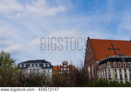 Old Buildings And Church St Dorothea With Sky At Background In Wroclaw