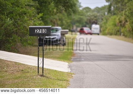 Typical American Outdoors Mail Box On Suburban Street Side